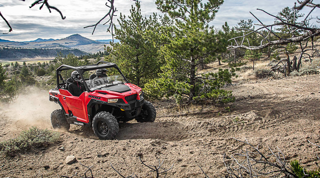 Polaris® General™ 1000 EPS riding in a forest